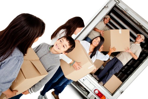Professional furniture pick-up service in Soho removing bulky items from an apartment