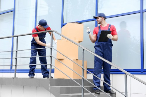 Removal team planning a move in a busy Soho street
