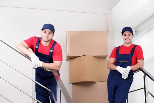 Removal team handling stairs and access in a central London flat