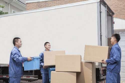 Professional office relocation services in Soho with moving team and office boxes