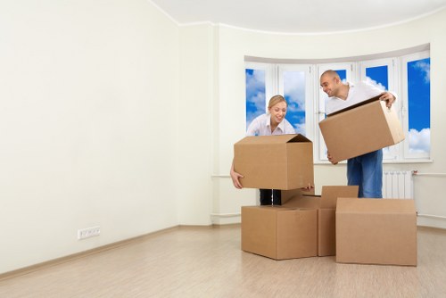 Removal team loading belongings into a van for a customer move