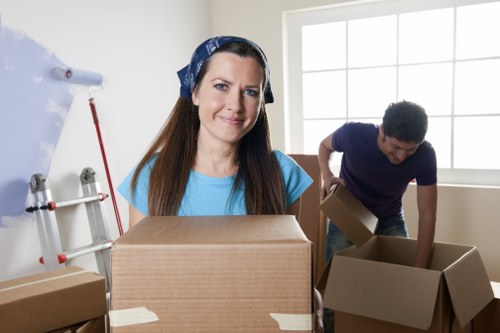Professional movers handling furniture for a same day Soho relocation