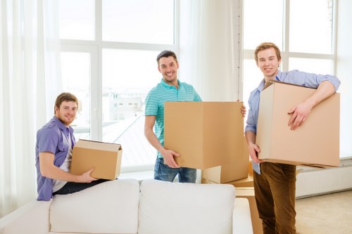Movers carrying furniture during a Soho relocation
