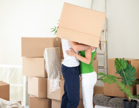 Staff using safe lifting techniques during a move