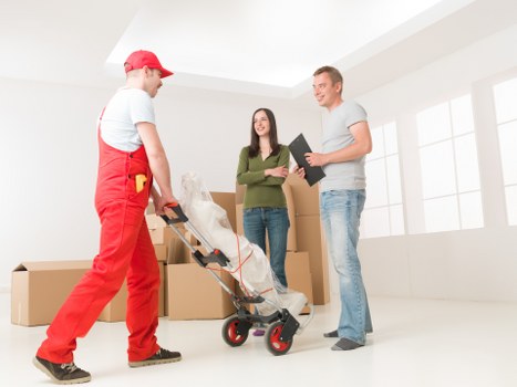 Packed boxes and furniture prepared for a Soho relocation