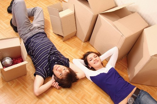 Unpacking household items into a new Soho apartment